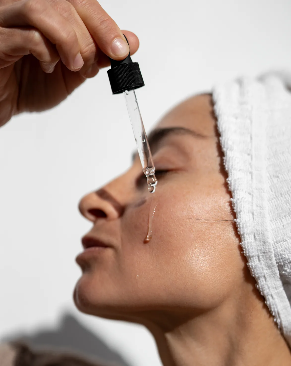 Hydrating serum applied to the skin with a dropper